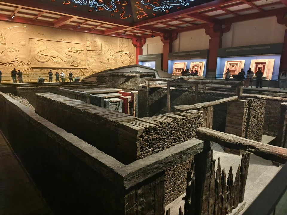 Panoramic view of the Dabaotai Han tomb's timber stacks and burial pit